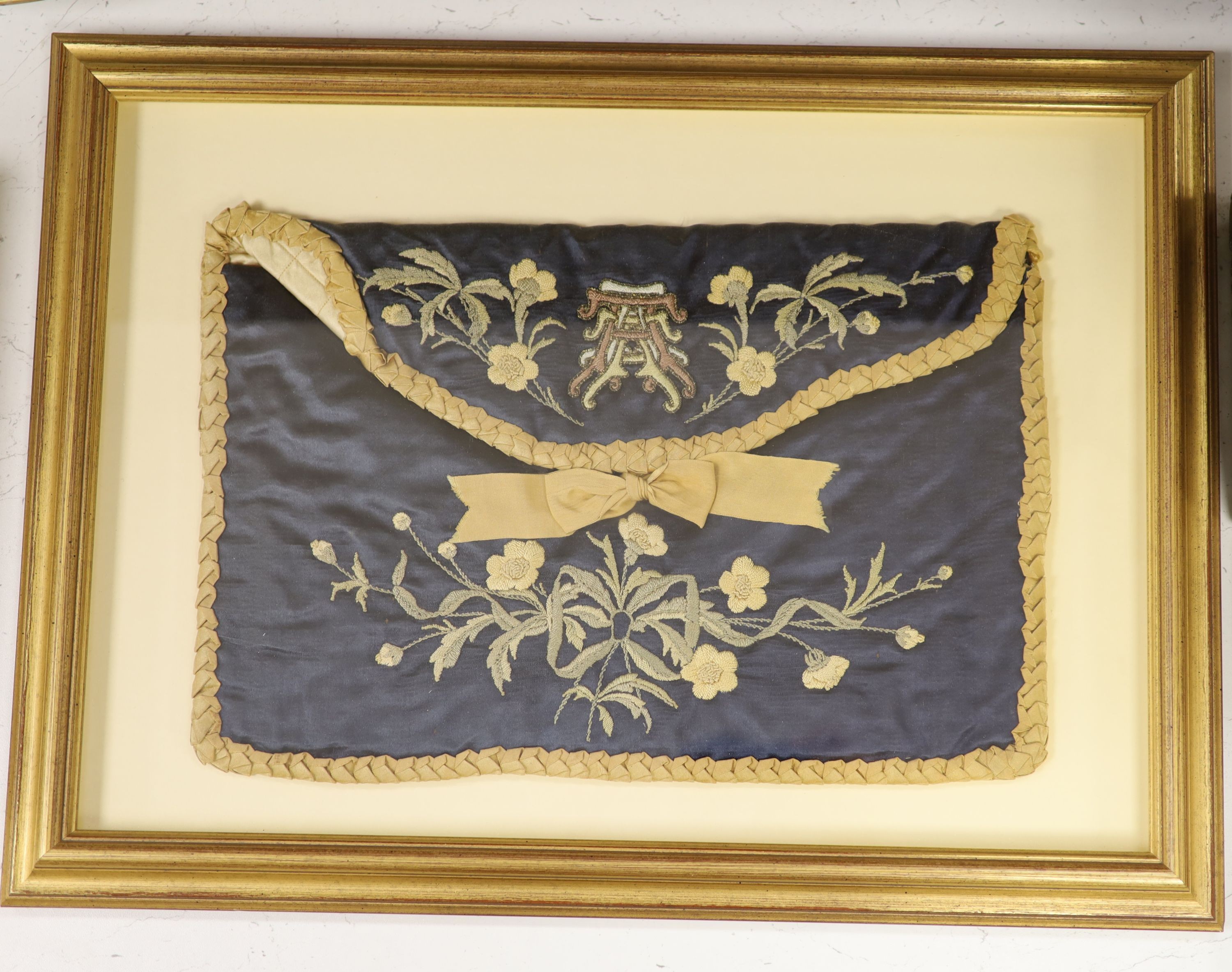 A framed 19th century embroidered silk bag 26x38cm